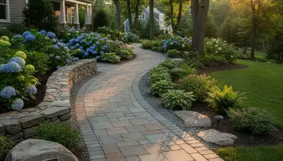 Curved stone paver walkway installed by Chop Chop Landscaping in Waltham, MA garden landscape